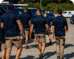 Plumbers walking to their service vans on a Rookwood job